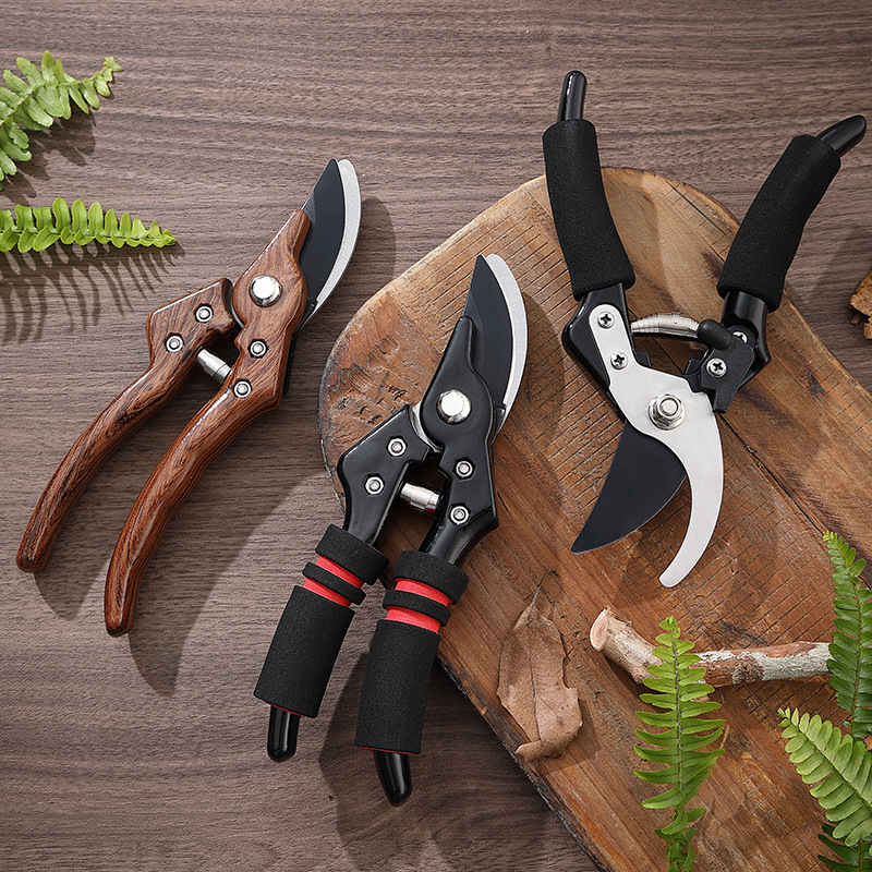 Garden hand tools on wooden table